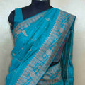 Sophisticated Teal Blue Tussar Saree with Intricate Woven Resham Design